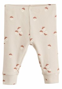 Helle beige, gerippte Baumwollleggings mit einem verspielten Muster aus braunen Eicheln und kleinen Gesichtern, mit elastischen Bündchen und einem elastischen Taillenbund.