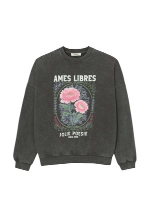 Sweat-shirt gris foncé avec motif floral rose encadré de vignes décoratives et texte blanc "AMES LIBRES" et "JOLIE POÉSIE DEPUIS 1975" sur le devant.
