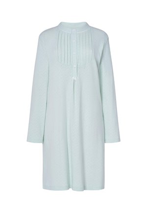 Túnica de un suave verde menta con un patrón de espiga texturizado, que presenta un cierre frontal con botones, pliegues y mangas largas.