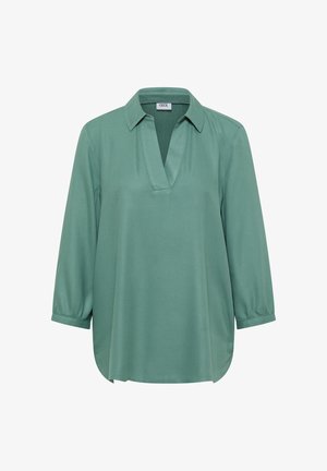 Zelená dlouhá blůza s výstřihem do V, límcem a nařasenými manžetami, vystavená na bílém pozadí.