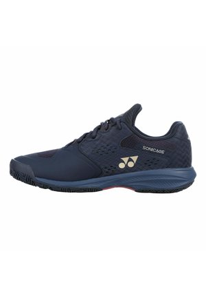 Scarpa sportiva blu navy con design con lacci, ventilazione a rete, suola ammortizzata e logo del marchio "Sonicage" sul lato.