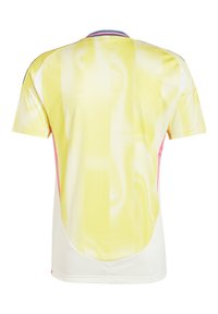 Kortärmad tröja med ett gult prickigt mönster, vita sidor och rosa detaljer längs fållen och ärmarna. Slät, andningsbar tyg.