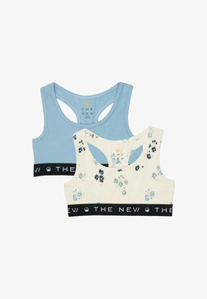 Deux brassières de sport pour enfants, une bleu clair et une blanche avec un imprimé floral bleu, toutes deux avec des bandes élastiques noires indiquant "THE NEW".