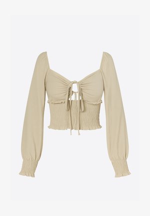 Lichtbeige cropped top van gladde stof; heeft lange, pofmouwen, een geraffineerde buste met een strik aan de voorkant en een gerimpelde textuur aan de taille.