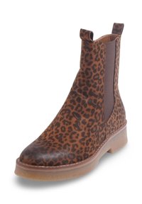 Bottes cheville imprimées léopard en fausse fourrure texturée, avec des panneaux latéraux élastiques, un bout arrondi et un petit talon en caoutchouc transparent.