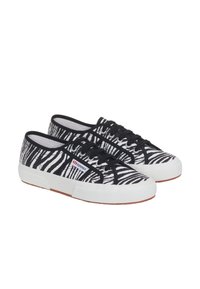 Sneakers in tela con motivo zebras in bianco e nero, con lacci neri, suole in gomma bianche e un logo visibile sul lato.