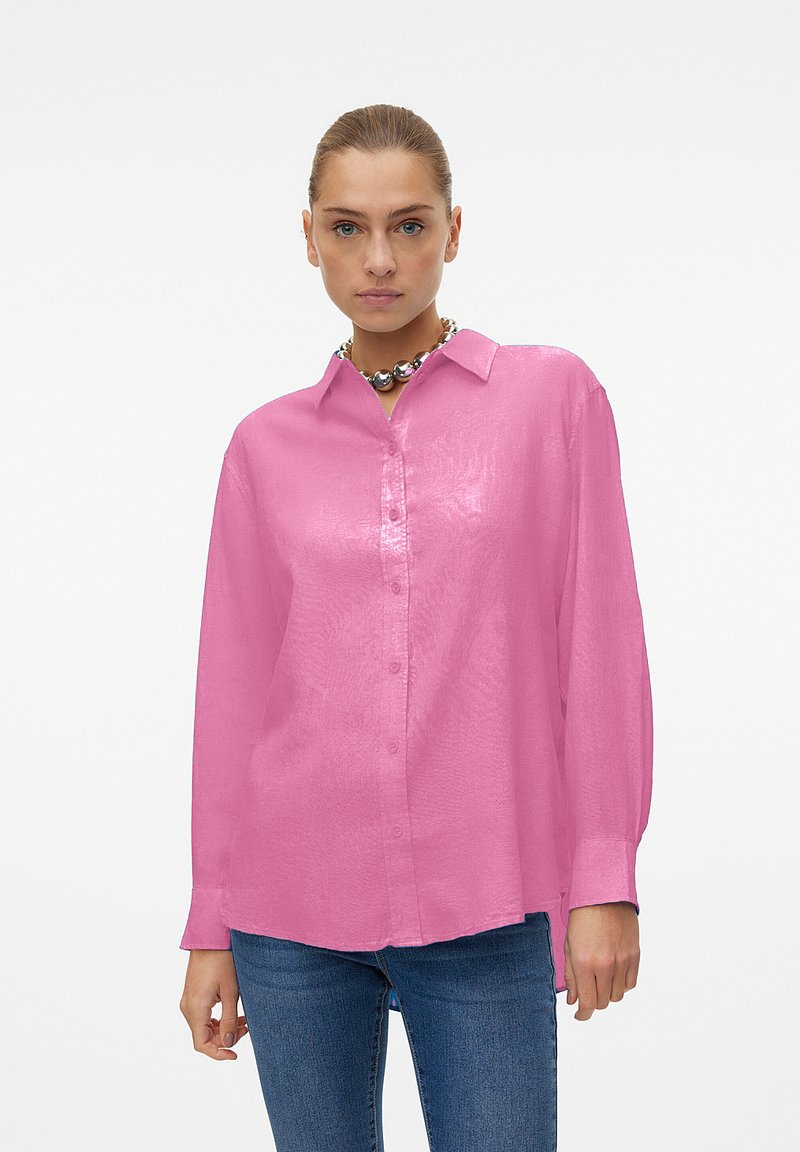 Pink, long-sleeved button-up shirt with a lightweight, slightly glossy texture and a classic collar. Paired with denim jeans.