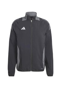 Giacca sportiva nera con accenti grigi, con zip frontale completa, colletto alto e tasche laterali. Presenta dettagli riflettenti e un logo ricamato.