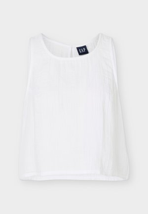 Λευκό κοντό αμάνικο τοπ με στρογγυλή λαιμόκοψη και ετικέτα GAP στο πίσω μέρος του γιακά εσωτερικά.