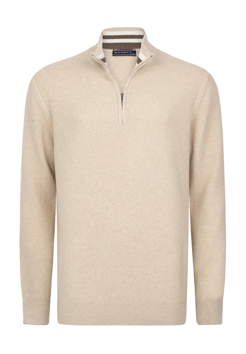 Beige vetoketjullinen neulepaita, joka on valmistettu teksturoidusta kankaasta ja jossa on pitkät hihat sekä resorireunat hihoissa. Koristeltu raidallisella kauluksen yksityiskohdalla.