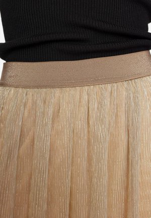 Pleated, vaalean kultainen hame, jossa on metallinen kiilto, leveällä joustavalla vyötäröosalla, joka on sileä vaaleanbeige.