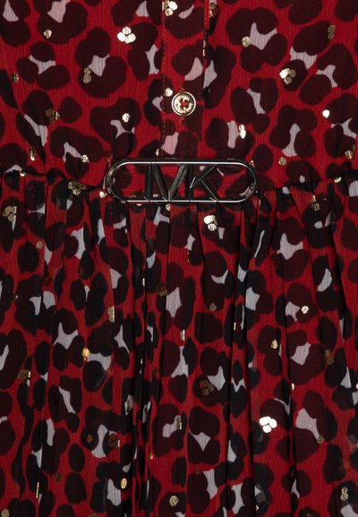 Red dress with a leopard print pattern, accented by gold sequins. Features a gathered waist and silver hardware with "MK" logo.