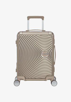 Hard-shell suitcase in metallic bronze, featuring a circular ribbed design, retractable handle, and four 360-degree spinner wheels.