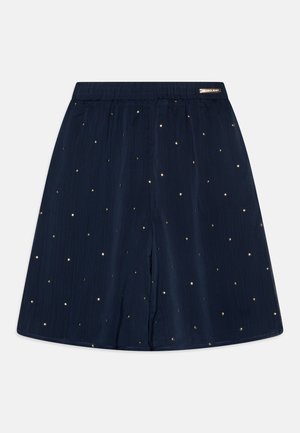 Jupe bleu marine à coupe décontractée, ornée de points décoratifs dorés et d'une taille élastique pour plus de confort. Conçue en tissu léger.