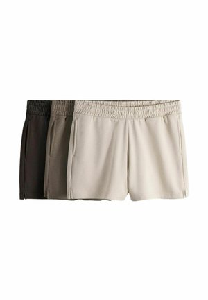 Tri páry bežných šortiek s elastickým pásom v krémovej, taupe a tmavohnedej farbe, usporiadané vedľa seba na bielom pozadí.