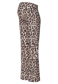 Luipaardprint leggings met een hoge tailleband, gemaakt van een zachte, rekbare stof in beige met zwarte en bruine vlekken. Uitlopende pasvorm.