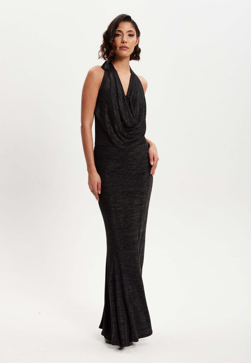 Black halter-neck gown with a draped bodice and fitted waist, flaring at the bottom. Made of a soft, textured fabric with subtle sheen.