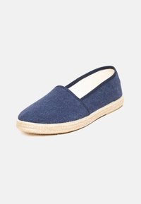 Navy blue canvas espadrille with a jute rope sole, rounded toe, and textile upper. Simple design with a low-cut profile.