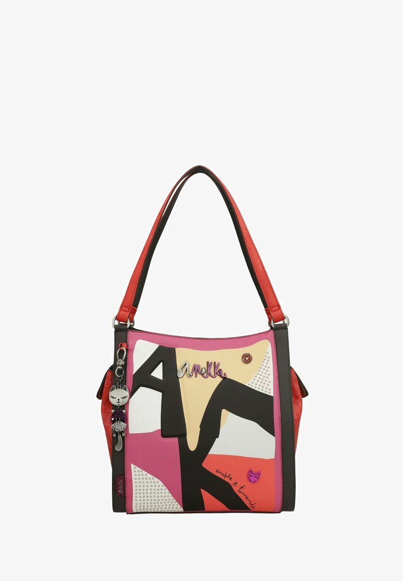 Sac à main multicolore avec des panneaux rose, noir et crème. Comprend des accents texturés et un porte-clés avec un motif de chat. Deux anses d'épaule.