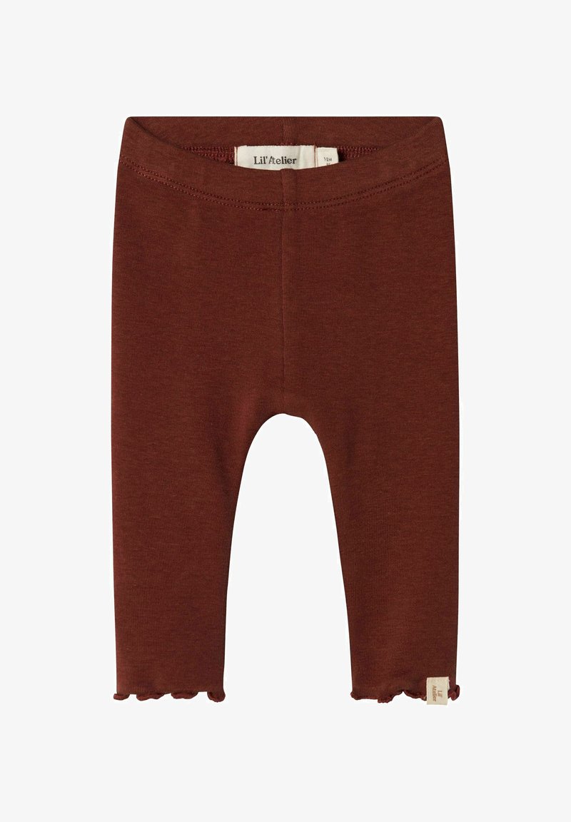 Brązowe legginsy bawełniane o prążkowanej teksturze, w długości 7/8, z falbaniastym wykończeniem. Posiadają wplecioną metkę na dolnej stronie.