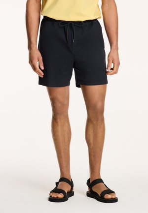 Navy swim shorts with an elastic waistband and adjustable drawstring, featuring side pockets and a smooth fabric texture.