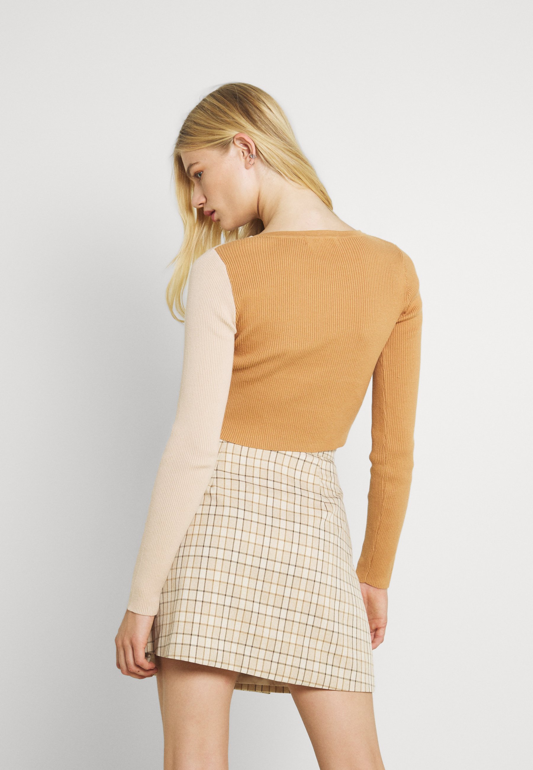beige colour cardigan