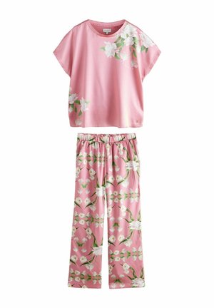 Pink floral lounge set featuring a short-sleeve top with a smooth texture and loose fit, paired with matching elastic waist pants, both adorned with white blossoms.