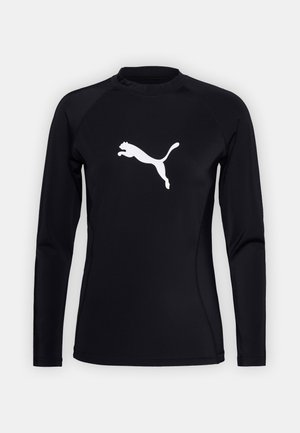 Zwart sportshirt met lange mouwen, gemaakt van een soepele stof, met een wit springende puma-logo op de borst en een ronde halslijn.