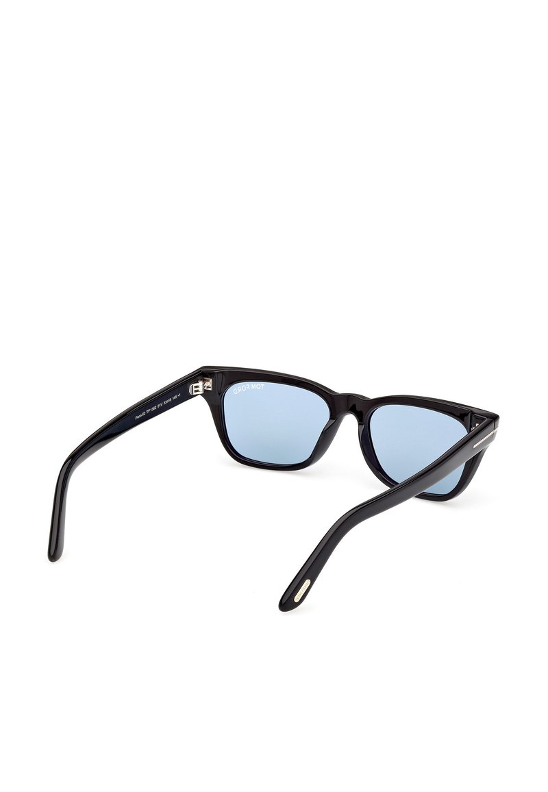 Zwarte acetaat zonnebril met blauwe lenzen, in een cat-eye vorm, met dunne pootjes en metalen accenten bij de scharnier. Geen zichtbare logo's.