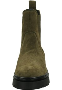 Khaki suede ankle boot with elastic side panels, round toe, and a chunky black rubber sole. Features a pull tab for easy wear.