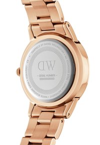 Rose gold stainless steel watch with a polished finish, featuring a round silver dial, engraved text, and a durable metal bracelet.