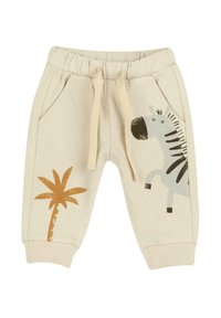 Pantalon de survêtement beige clair avec une taille élastique, orné d'un motif zèbre et palmier en accents noirs et bruns. Deux poches latérales.