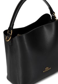 Black leather handbag with a smooth texture, gold hardware accents, and a rounded silhouette. Features a structured design and a short handle.