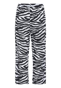 Fekete-fehér csíkos zebra mintás nadrág laza szabással, elasztikus derékkal és könnyű anyaggal. Egyenes szárú dizájn és puha textúra.