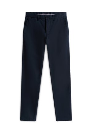 Marineblå, smale bukser laget av lett stoff. Har frontlommer, glidelås og enkelt knappelukking i linningen.