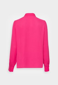Pink long-sleeve blouse with a classic collar, smooth texture, and buttoned cuffs, featuring a straight cut and no visible patterns.