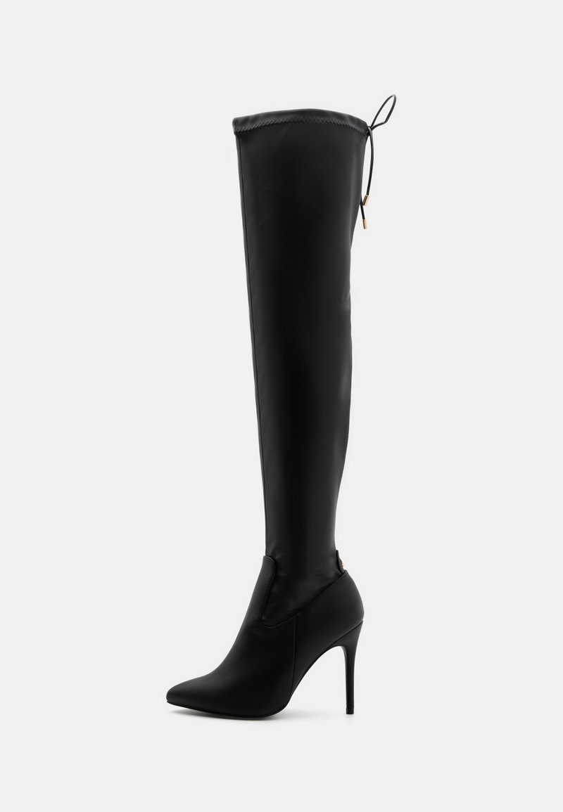 Botas negras hasta el muslo con un diseño ajustado y elegante, puntera afilada, tacón alto de aguja y un detalle de cordones en la parte superior con un acabado mate suave.