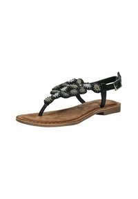 Sandalo piatto nero con decorazioni di perline metalliche, una fascia tra le dita, fibbia regolabile alla caviglia e una soletta marrone testurizzata.