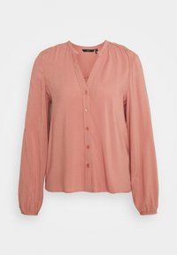 Blouse rose à manches longues avec un décolleté en V et une fermeture à boutons, présentant des détails froncés aux épaules et des poignets élastiques, fabriquée à partir d'un tissu doux.