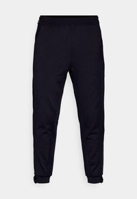 Calças de exercício pretas feitas de tecido suave, apresentando zíperes laterais, uma cintura elástica e punhos ajustados nos tornozelos.