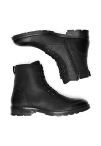 Melni ādas potīšu zābaki ar apaļu purngali, ar sānu rāvējslēdzēju, auklām priekšā un teksturētām zole, kas nodrošina saķeri.