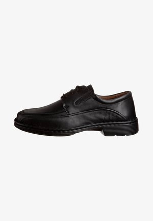 Scarpa da uomo in pelle nera, con lacci, tacco basso, punta arrotondata e dettagli di cucitura sottili.