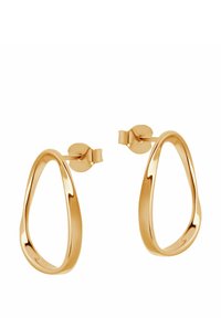 Złote metalowe kolczyki w kształcie dużych kół z wydłużonym kształtem łzy, z gładką, lustrzaną powierzchnią i bezpiecznymi zapięciami na sztyfty.