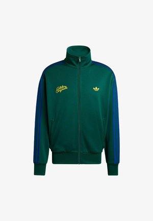 Green Adidas Originals zip-up track jacket with blue stripes on sleeves and yellow logos on chest.