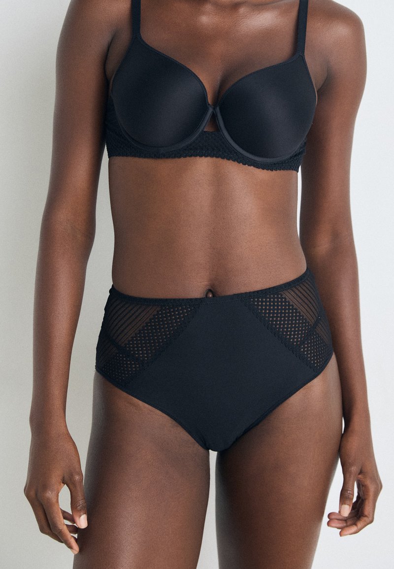 Black bra and high-waisted underwear set, featuring smooth fabric, a lace trim on the bra, and mesh paneling on the underwear sides.
