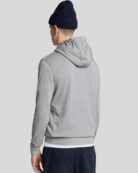 Gray cotton hoodie with a drawstring hood, ribbed cuffs, and hem, worn over a white shirt; paired with a navy knitted beanie.
