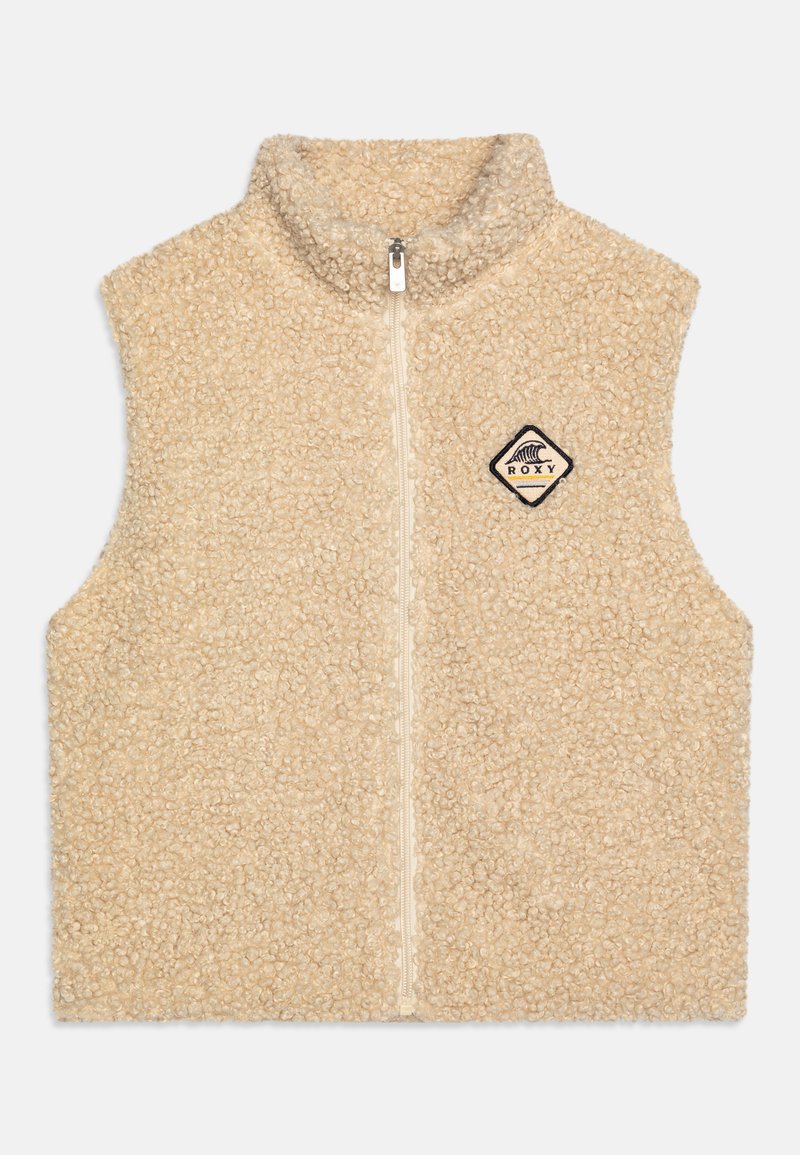 Beige fejkpälsväst med hög krage, framzipning och en diamantformad Roxy-logotypapplikation på vänster bröst.