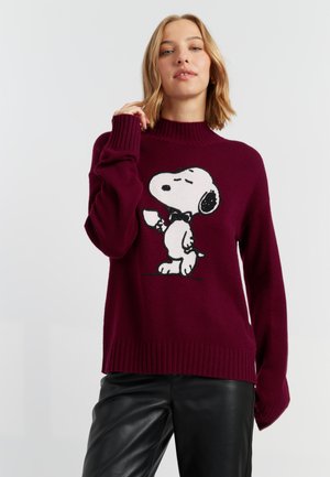 Burgundy sweater made of knit material with a high neckline, featuring a black and white Snoopy graphic on the front. Ribbed hem and cuffs.