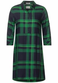 Abito camicia a quadri verde e blu navy con maniche a tre quarti, colletto con bottoni e parziale abbottonatura frontale.