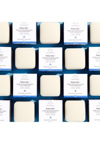 Pekee Bar soap in off-white with a smooth surface, packaged in blue and white boxes featuring an elephant logo and text details.